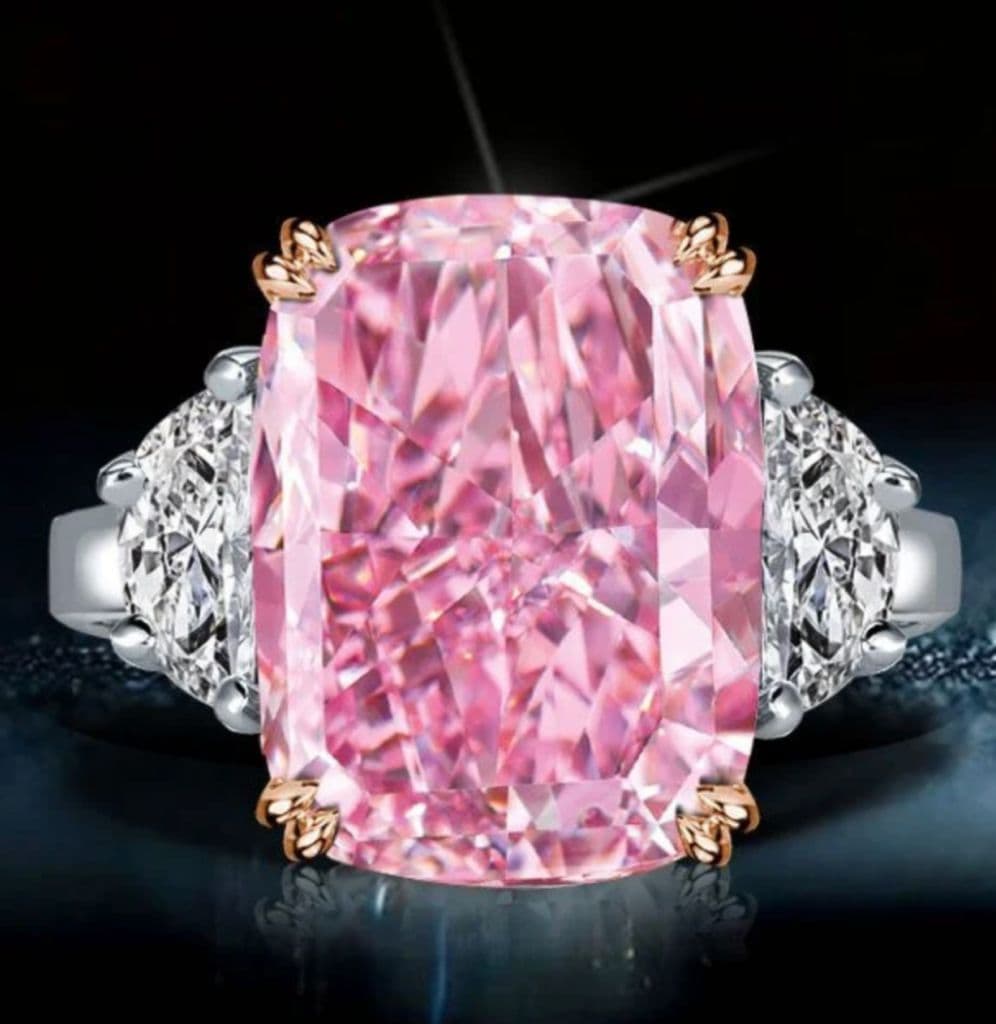 Pink cushion three-stone ring